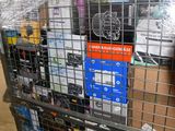 a metal cart with many items in it in a warehouse