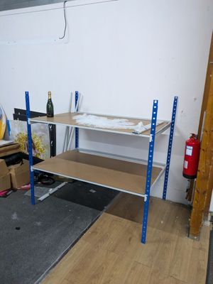 a room with a shelf and a chair in it