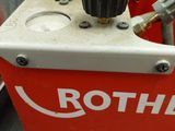 a red box with tools in it sitting on a table