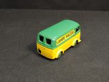 a toy bus that is sitting on a black surface