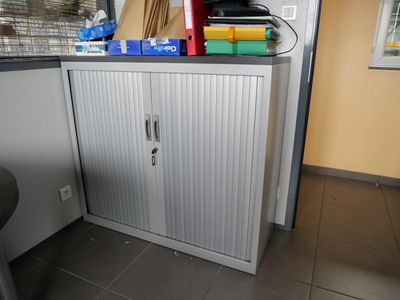a cabinet with a bunch of items on top of it