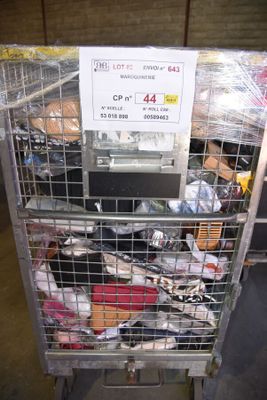 a metal cart with a bunch of items inside of it