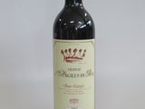 a bottle of wine that is sitting on a table