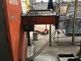 a machine that is working on a piece of metal