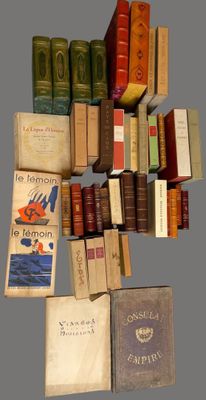 many books that are stacked on top of each other