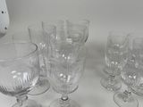 a lot of empty wine glasses sitting on a table