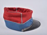 red, blue and grey hat with a leather brimle on top