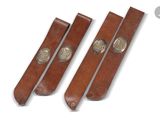 three brown leather straps with silver buckles on a white background