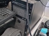 a laptop computer sitting on top of a desk next to a computer monitor