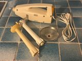 an image of a hand held vacuum cleaner on a tiled floor