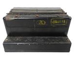 a black box with a yellow sticker on it