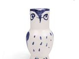 blue and white owl shaped vase on a white background