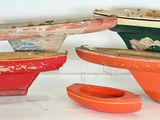 three small wooden bowls and a bowl on a stand