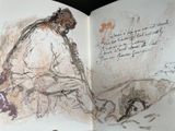 a book with a drawing of a man sitting on a bench