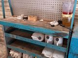a blue workbench with a bunch of items on it