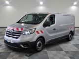 the silver van is parked on a checkered floor in a garage