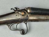 an old gun that is on display on a table