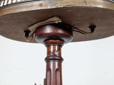 a wooden table with two candles on top of it