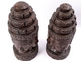 pair of asian carved wooden vases on white background