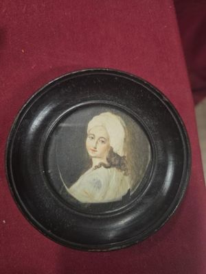 painting of a woman in a white dress with a black frame
