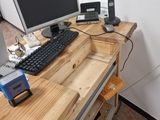 a desk with a keyboard and a monitor on it