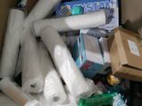 a cardboard box full of toilet paper and other items