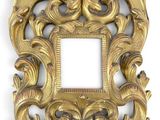 an ornate gold frame on a white background with a white background