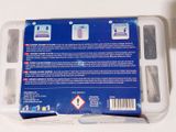 a package of toothbrushes in a plastic container on a table