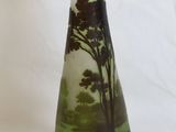 a vase that has a picture of a tree on it