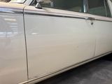 a white car that is parked in a garage