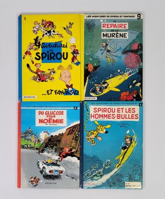 quatre livres pour enfants sont alignés sur une surface blanche