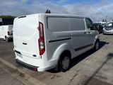 a white van that is parked in a parking lot