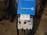 a machine that is sitting on the ground in the garage