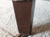 a close up view of a foot that is on a chair