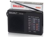 une photo d'une radio noire sur laquelle est posé un stylo