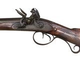 a close up of a rifle on a white background with a white background