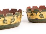 these are two pots with designs on them on a white surface