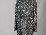 a black and white coat on a mannequin mannequin mannequin mannequin mannequin mannequin mannequin mannequin mann