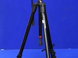 the tripod is sitting on a blue surface with a blue background
