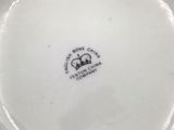 a white plate with a black and white design on it