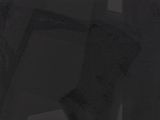 an image of a black and white photo of a chair in the dark