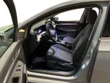 the interior of a car with the door open and the driver ' s seat up