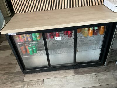 a refrigerator that has a lot of drinks inside of it