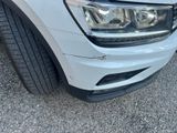 a close up of a white car with a black rim