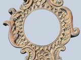 a picture of a decorative mirror hanging on a wall