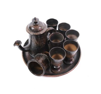 a tray with cups and a teapot on it