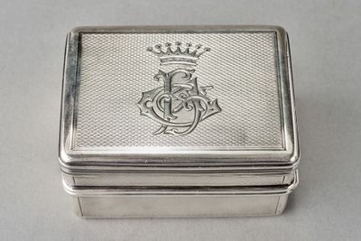 an antique silver box with a crown on top of it