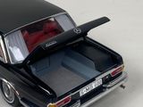 a black car with a red seat in the back of it