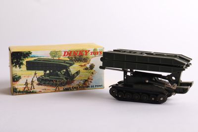 an image of a toy tank with a box on a white surface