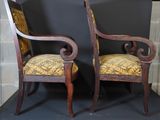 pair of antique chairs with upholstered upholstered back and arms